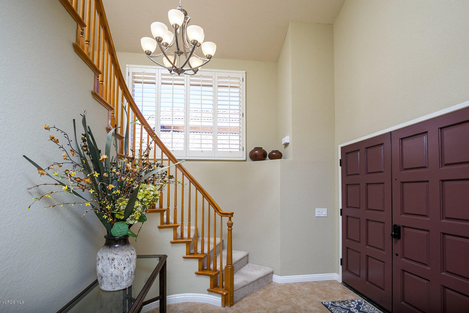 539 Galloping Hill Road Simi Valley, CA 93065 - Photo 6 of 30 a view of a hallway with wooden floor and chandelier