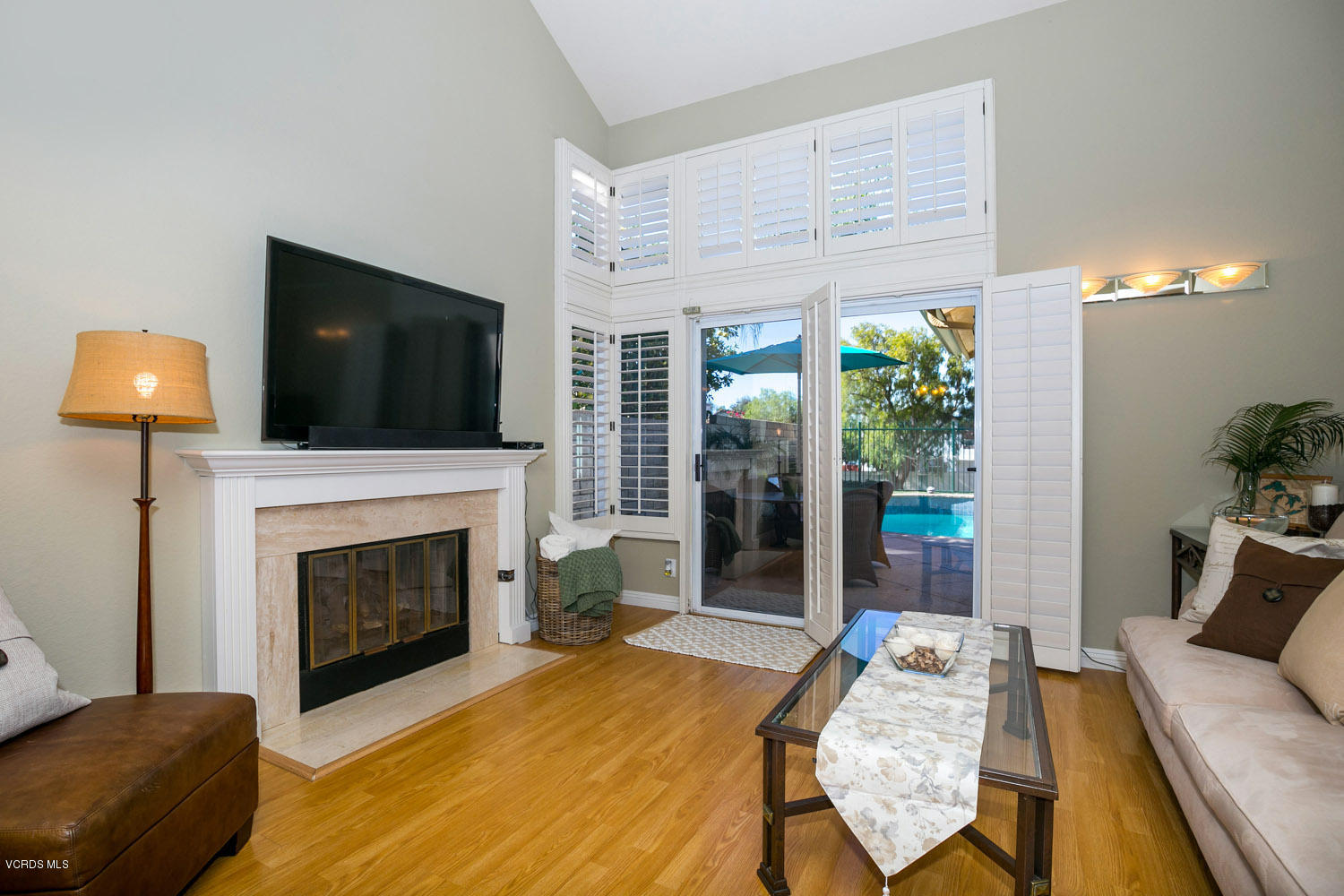 539 Galloping Hill Road Simi Valley, CA 93065 - Photo 8 of 30 a living room with furniture a fireplace and a flat screen tv