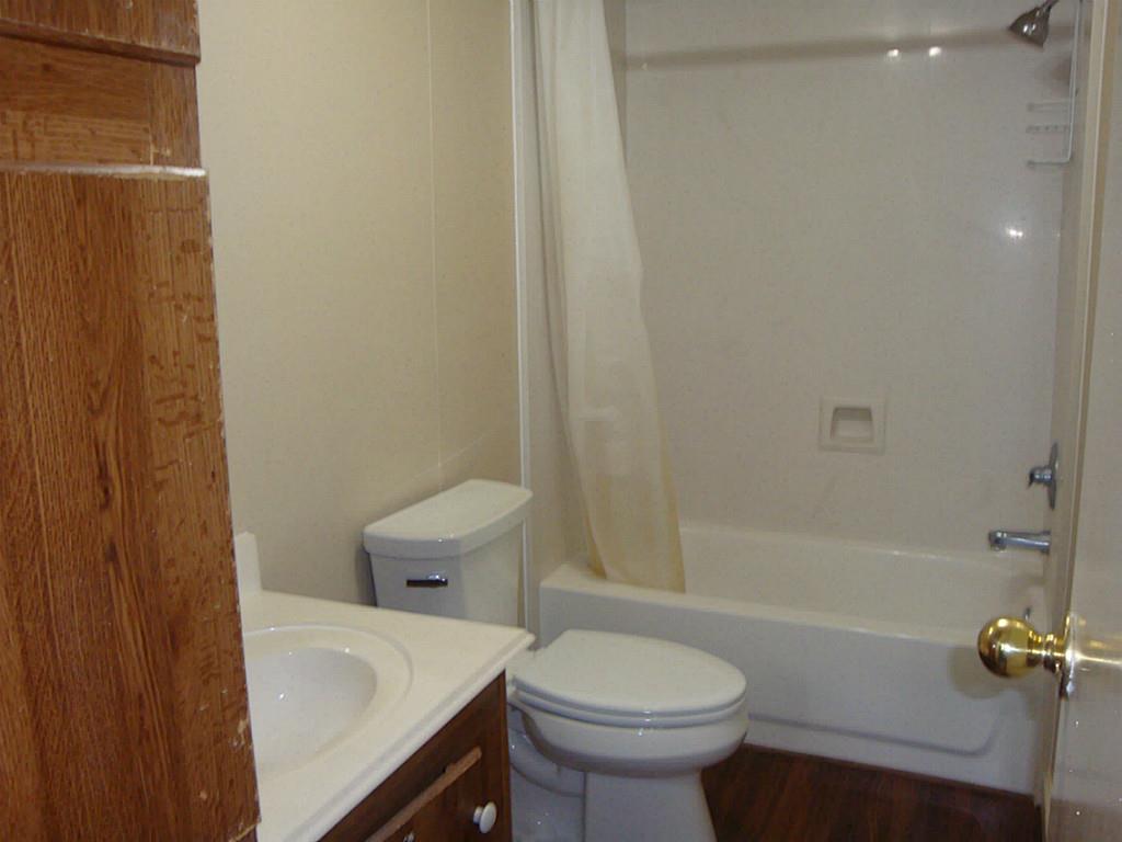2445 Precinct Line Road Richmond, TX 77406 - Photo 8 of 9 a bathroom with a sink a toilet and shower