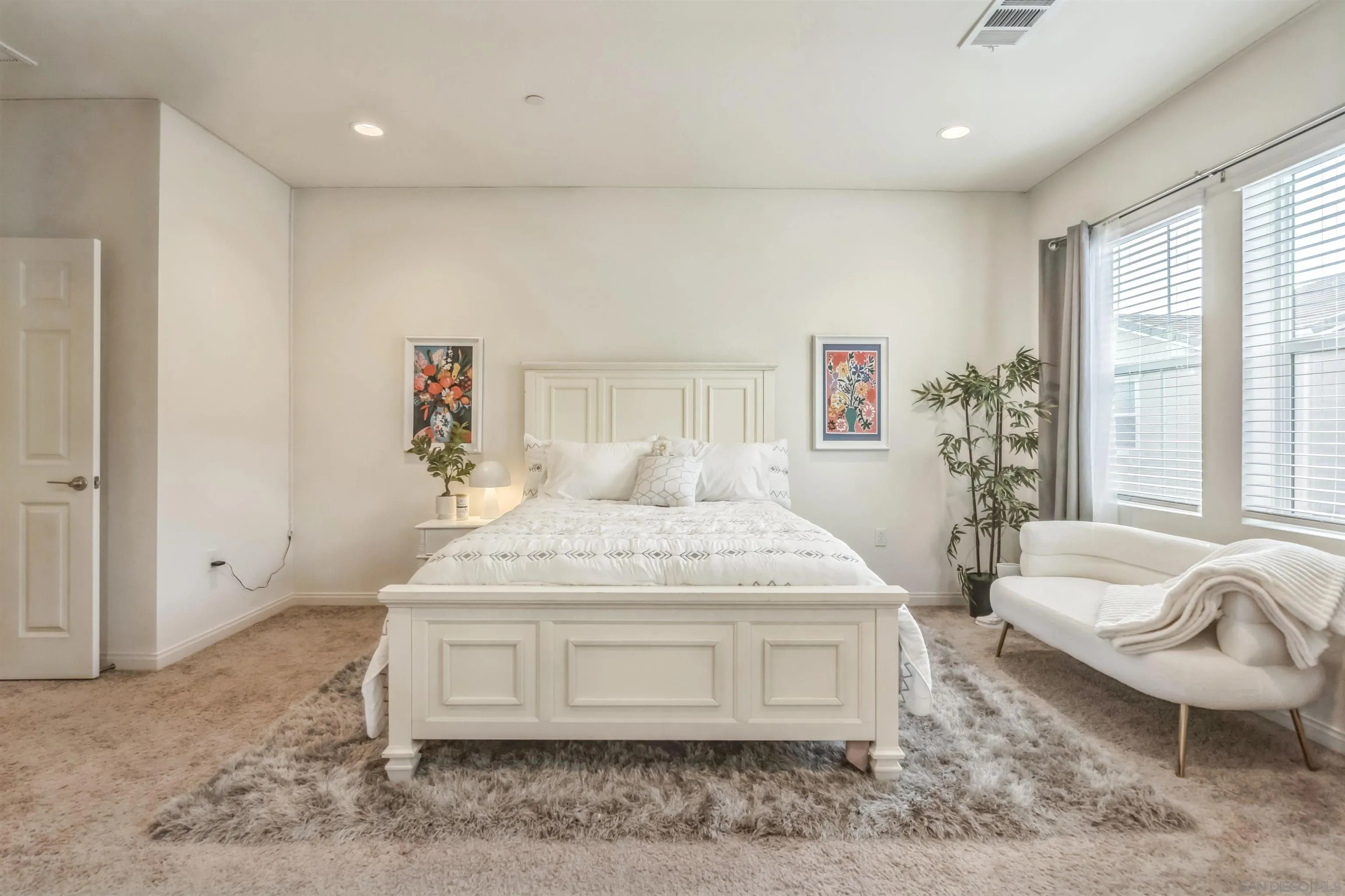2018 Barite Street Spring Valley, CA 91977 - Photo 37 of 47 a spacious bedroom with a bed and glass window