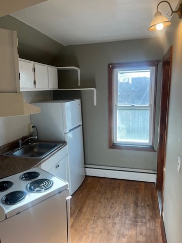14 Adams Street, Unit 3 Taunton, MA 02780 - Photo 6 of 6 a kitchen with a stove and a microwave