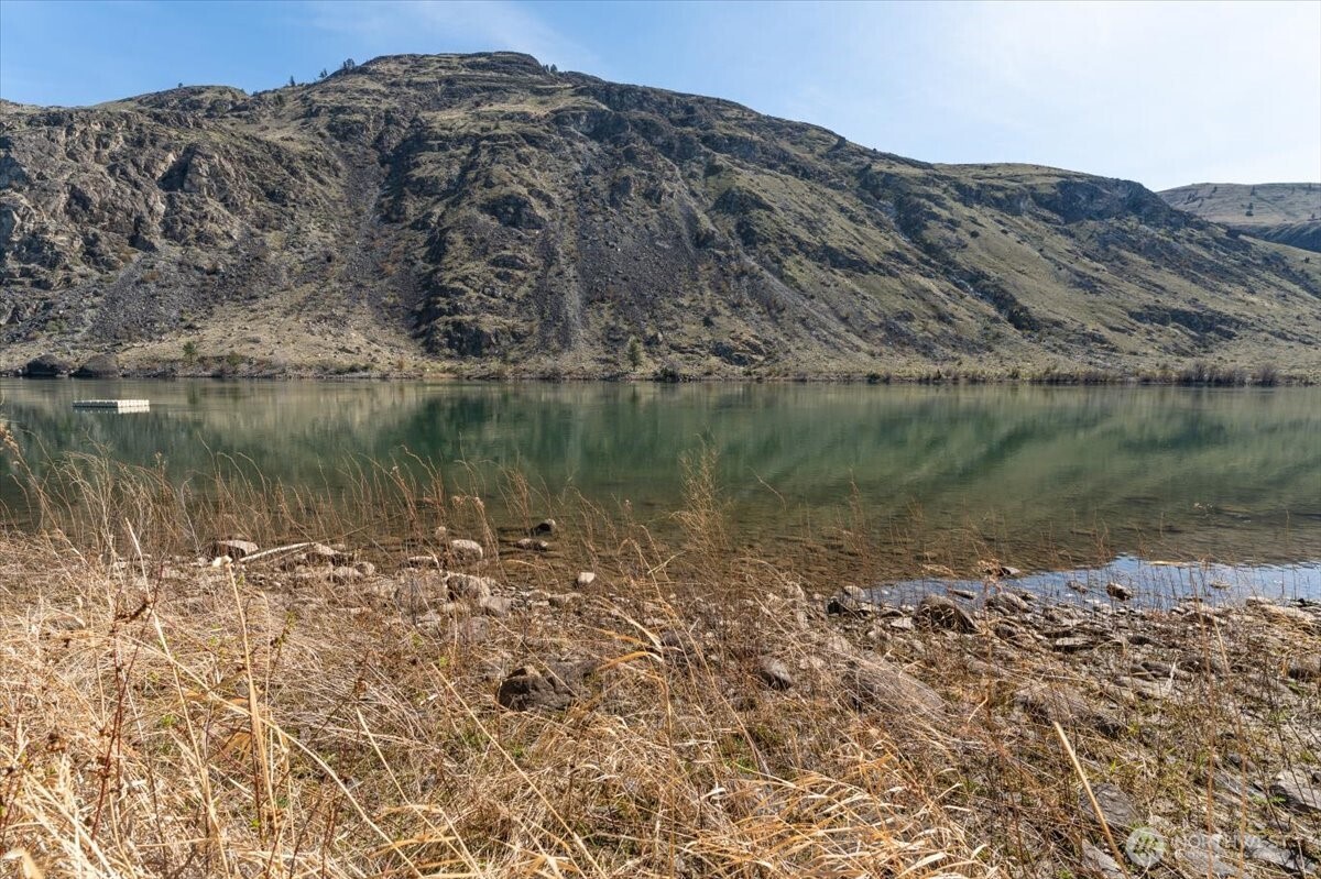 519 Hidden Lane Chelan, WA 98816 - Photo 15 of 25 a view of a lake with a mountain in the background