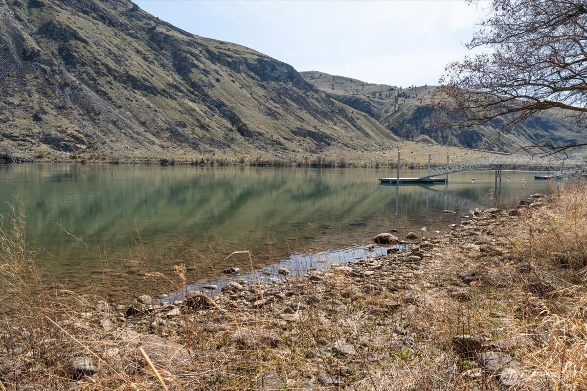 519 Hidden Lane Chelan, WA 98816 - Photo 16 of 25 a view of a lake with a mountain in the background