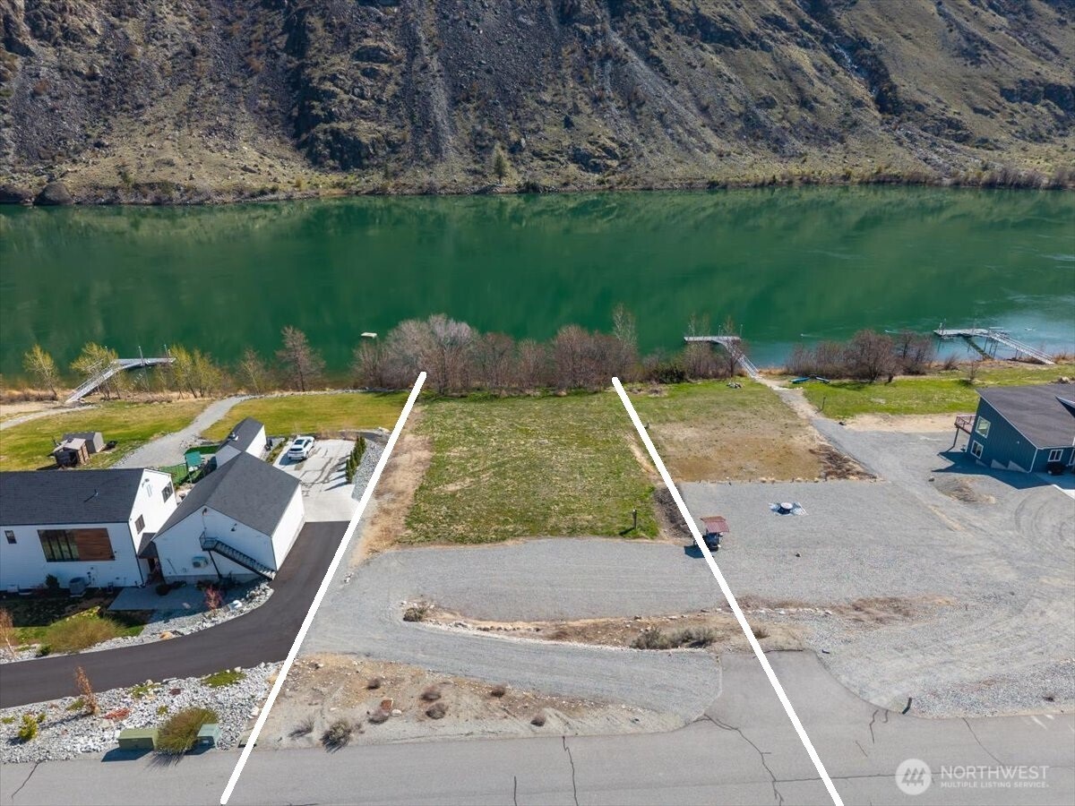 519 Hidden Lane Chelan, WA 98816 - Photo 2 of 25 an aerial view of a house with garden space and lake view
