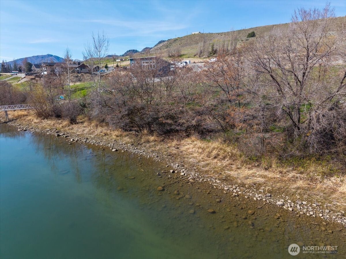 519 Hidden Lane Chelan, WA 98816 - Photo 21 of 25 a view of a lake with mountains in the background