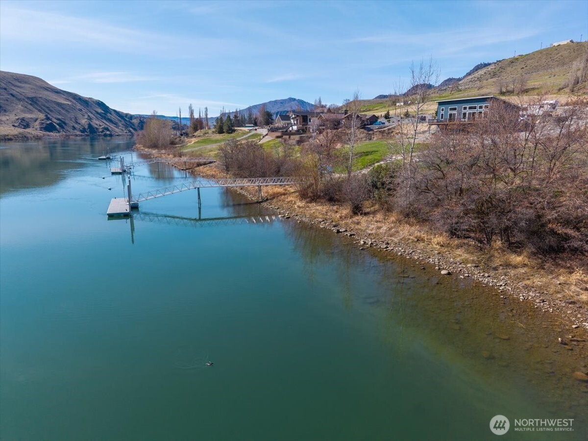 519 Hidden Lane Chelan, WA 98816 - Photo 22 of 25 a view of a lake with a mountain in the back