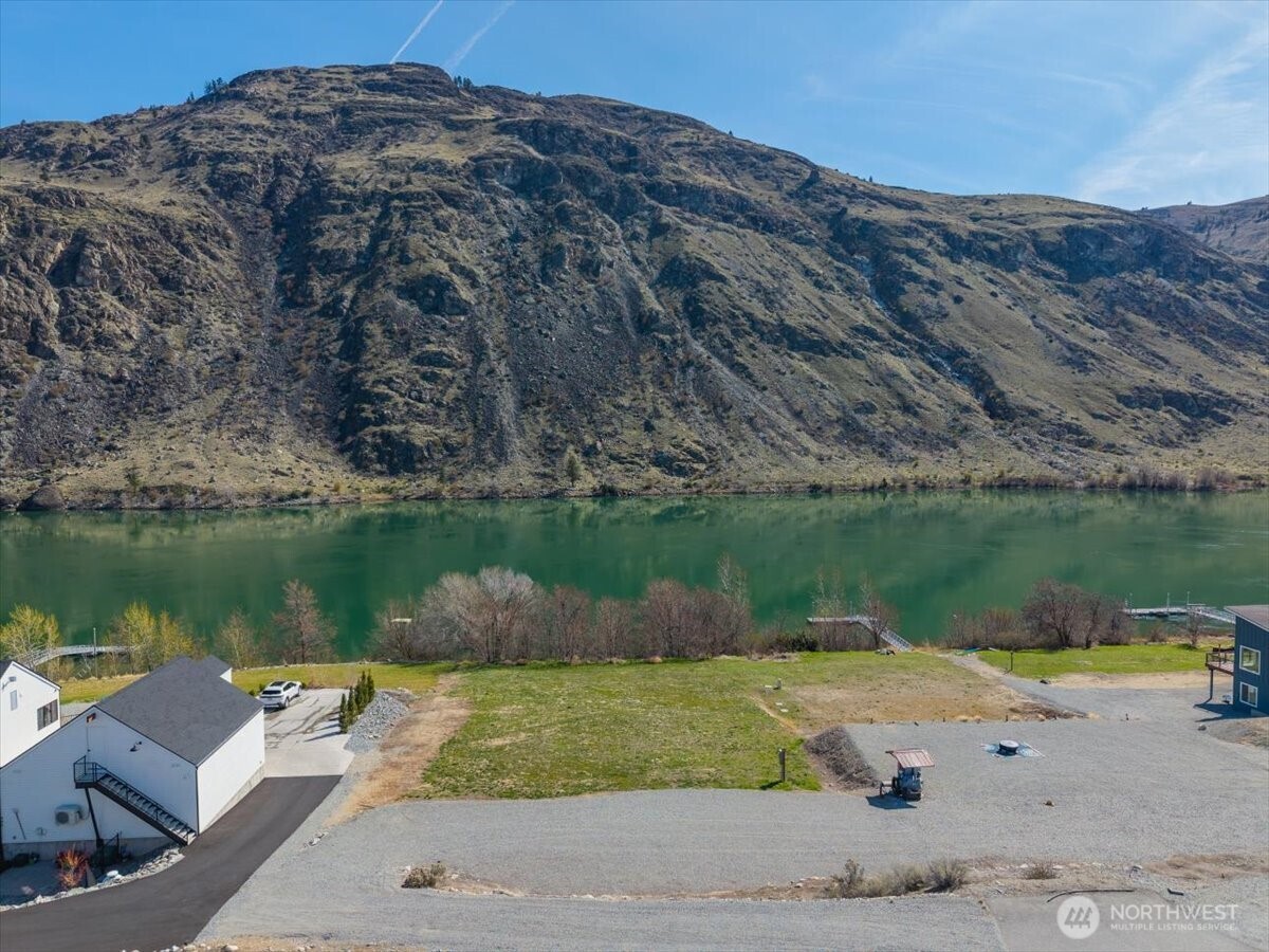 519 Hidden Lane Chelan, WA 98816 - Photo 3 of 25 a view of a lake with a mountain in the background