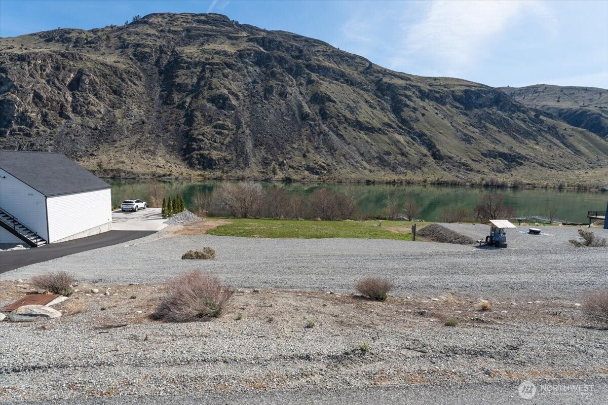 519 Hidden Lane Chelan, WA 98816 - Photo 6 of 25 a view of a dry yard with wooden fence