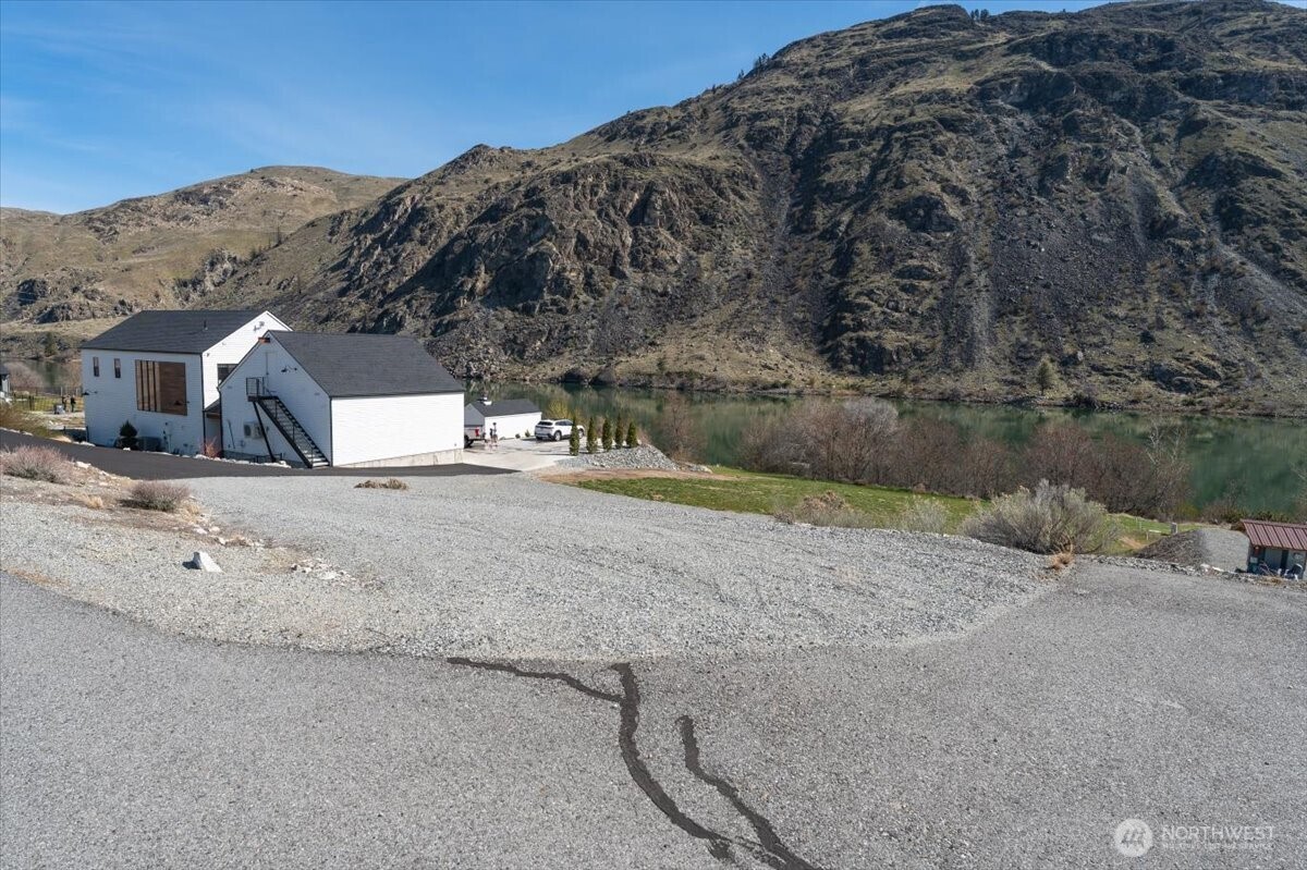519 Hidden Lane Chelan, WA 98816 - Photo 7 of 25 a view of a house with a yard