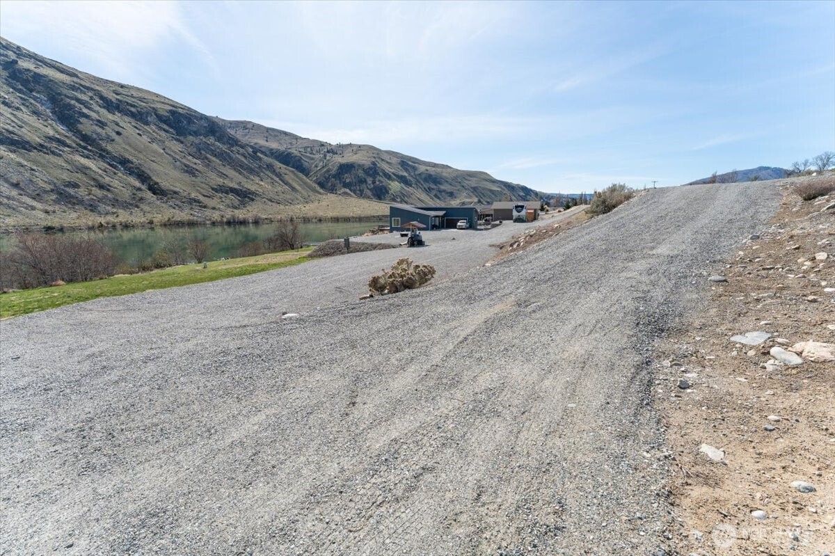 519 Hidden Lane Chelan, WA 98816 - Photo 8 of 25 a view of a field with mountains in the background