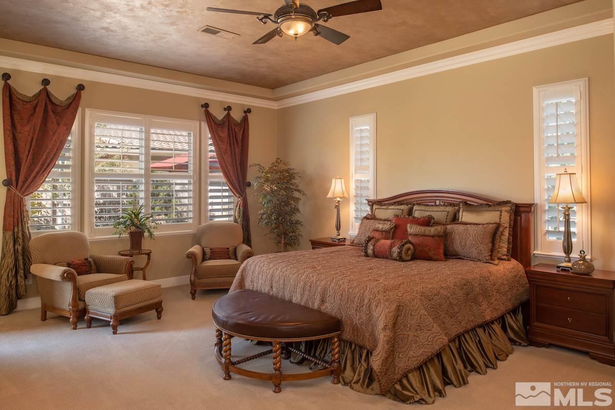 9895 Copenhagen Way Reno, NV 89521 - Photo 11 of 25 a bedroom with a bed and a couch