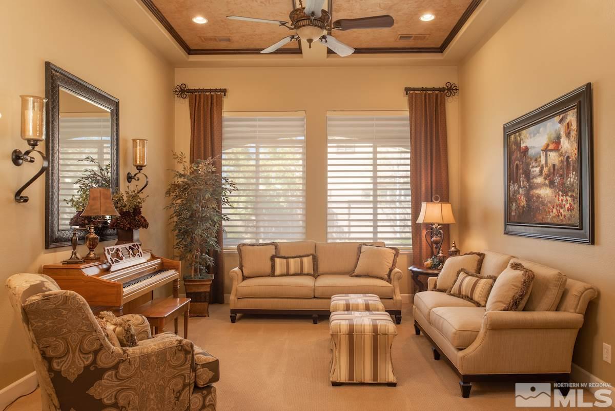 9895 Copenhagen Way Reno, NV 89521 - Photo 3 of 25 a living room with furniture and a large window