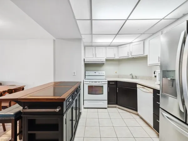 a kitchen with stainless steel appliances granite countertop a stove and a refrigerator