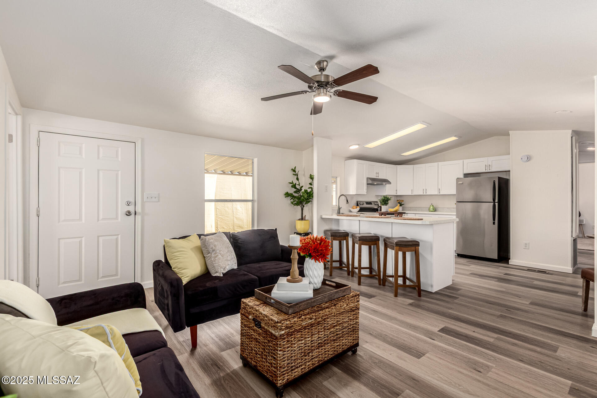 8401 South Kolb Road, Unit 94 Tucson, AZ 85756 - Photo 1 of 24 a living room with furniture and a kitchen view