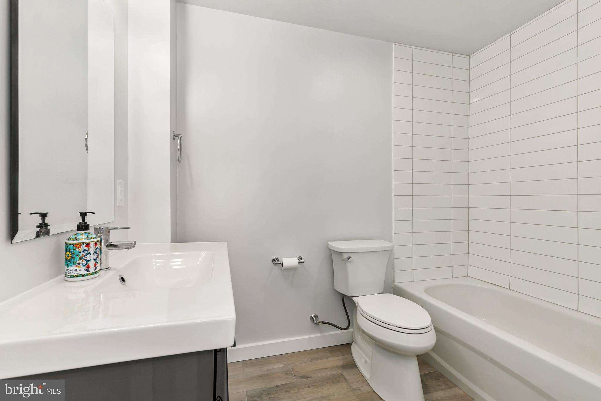 700 Roeder Road, Unit 603 Silver Spring, MD 20910 - Photo 9 of 21 a bathroom with a sink a toilet and bathtub
