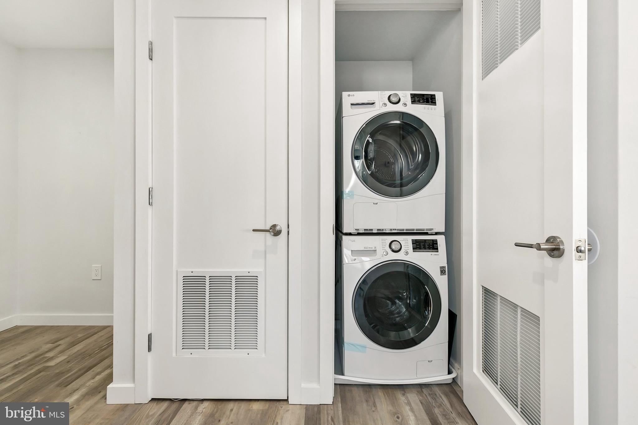 700 Roeder Road, Unit 603 Silver Spring, MD 20910 - Photo 10 of 21 a view of a hallway with washer and dryer