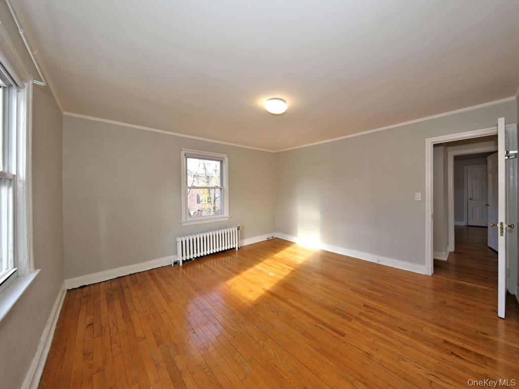 5 Laurel Street, Unit A3 Rye, NY 10580 - Photo 5 of 8 an empty room with wooden floor and windows