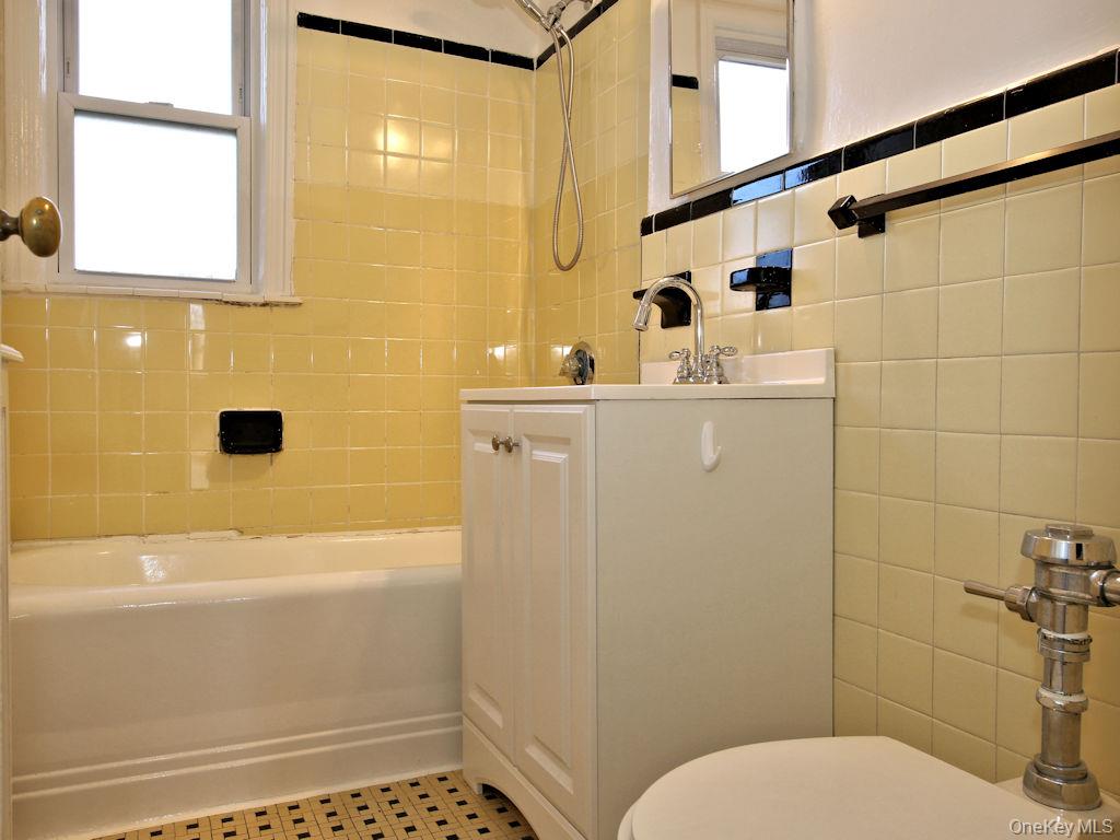 5 Laurel Street, Unit A3 Rye, NY 10580 - Photo 7 of 8 a bathroom with a sink a toilet and shower