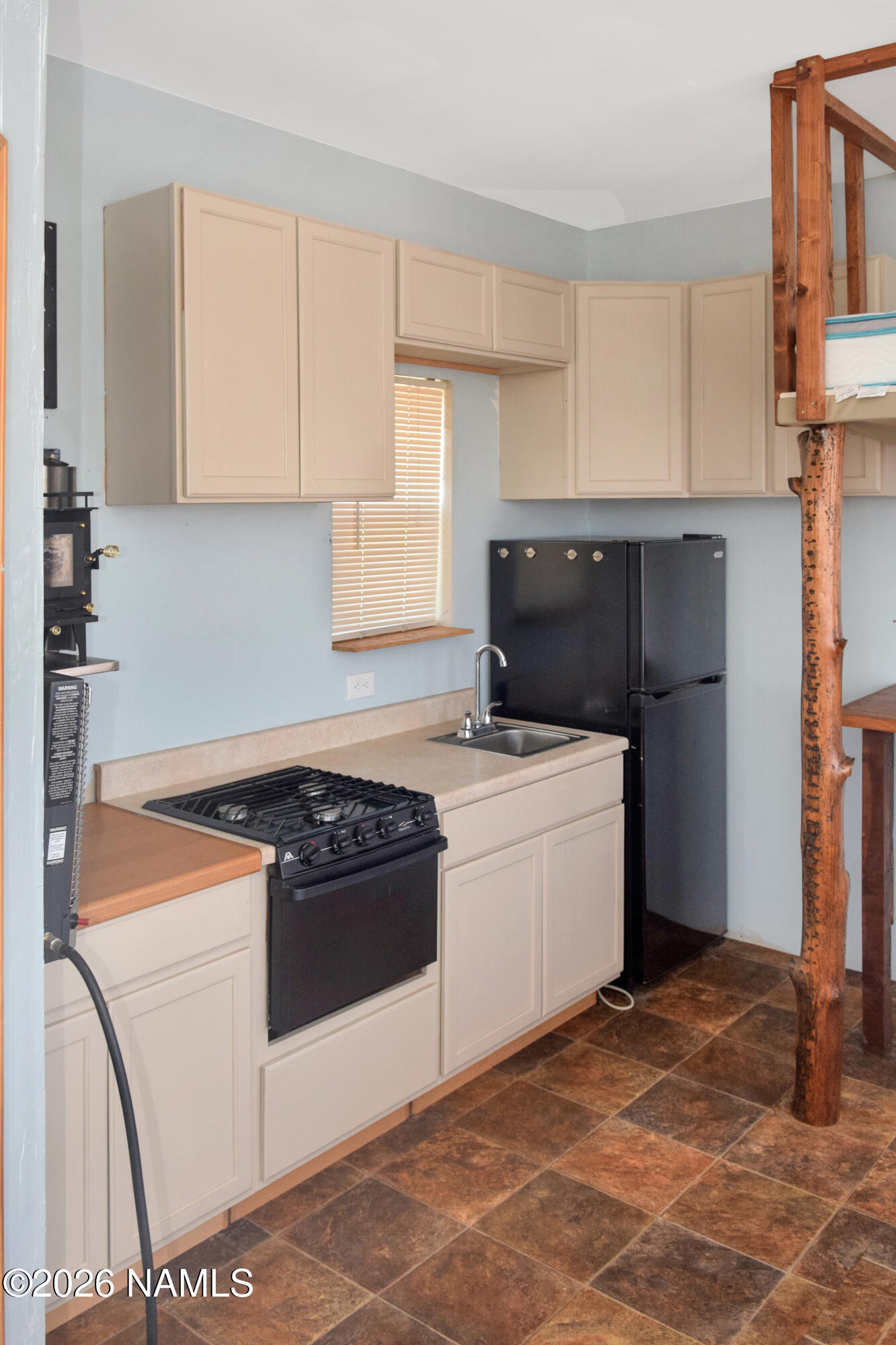 12417 East Tanner Rnch Road Flagstaff, AZ 86005 - Photo 8 of 21 a kitchen with a stove and a refrigerator