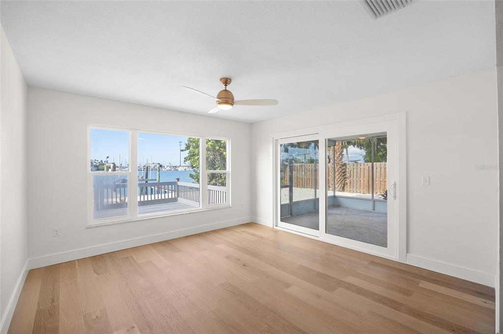 360 145th Avenue Madeira Beach, FL 33708 - Photo 12 of 64 a view of an empty room with a window