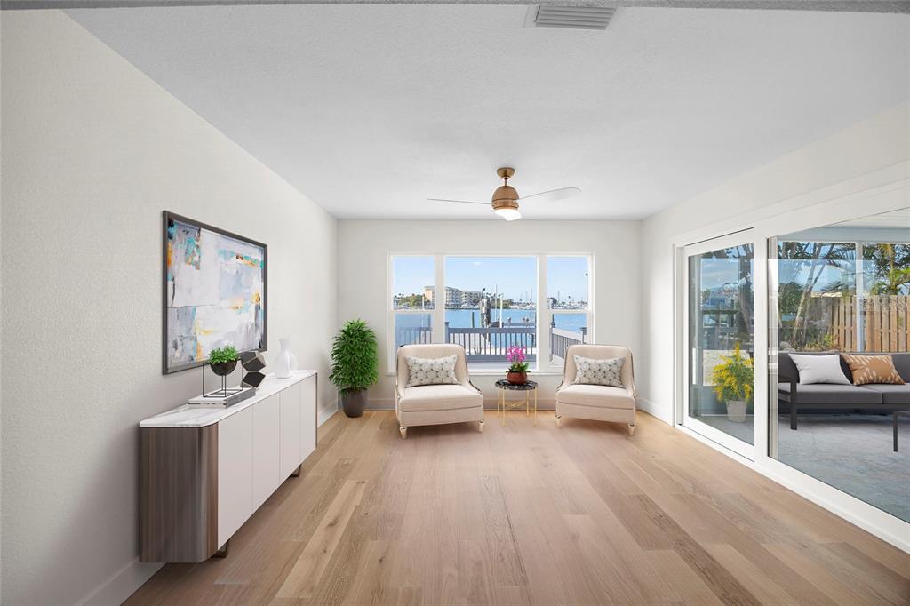 360 145th Avenue Madeira Beach, FL 33708 - Photo 14 of 64 a living room with furniture and a large window