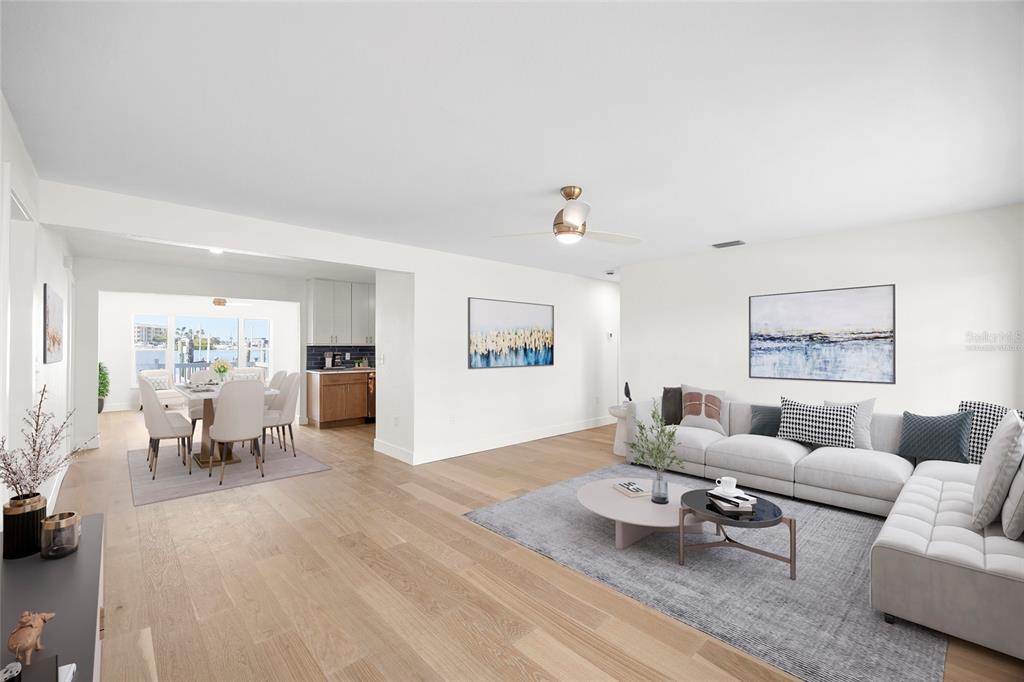 360 145th Avenue Madeira Beach, FL 33708 - Photo 16 of 64 a living room with furniture and a wooden floor