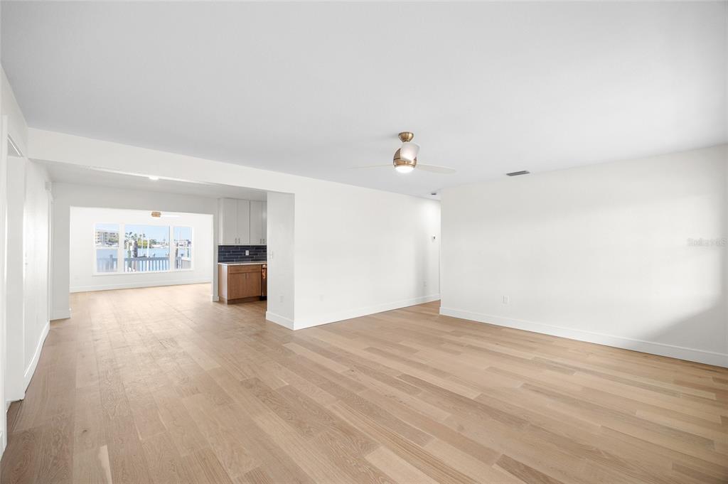 360 145th Avenue Madeira Beach, FL 33708 - Photo 17 of 64 a view of empty room with wooden floor
