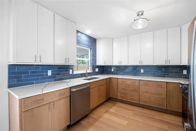 a kitchen with a sink and cabinets