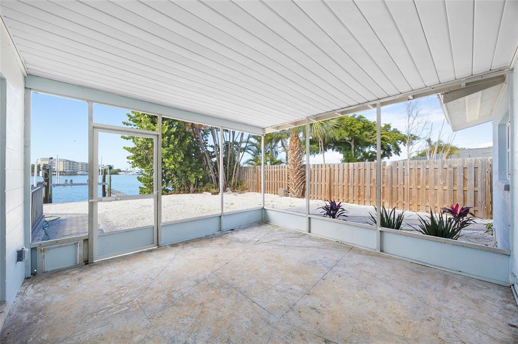 360 145th Avenue Madeira Beach, FL 33708 - Photo 31 of 64 a view of an outdoor dining space with furniture