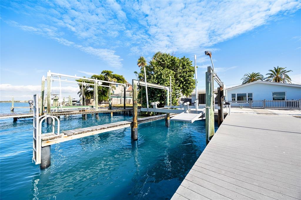360 145th Avenue Madeira Beach, FL 33708 - Photo 44 of 64 a view of a swimming pool with a patio