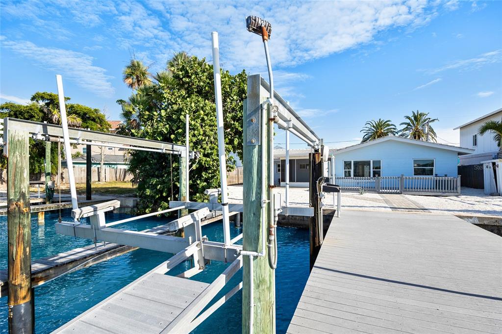 360 145th Avenue Madeira Beach, FL 33708 - Photo 45 of 64 a view of a house with a patio