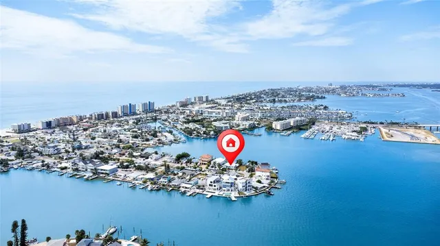 an aerial view of a house with a ocean view