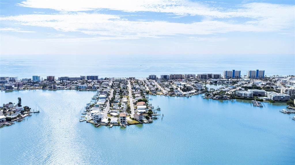 360 145th Avenue Madeira Beach, FL 33708 - Photo 50 of 64 an aerial view of ocean and residential houses with outdoor space