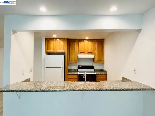 a kitchen with granite countertop a granite counter tops and a sink