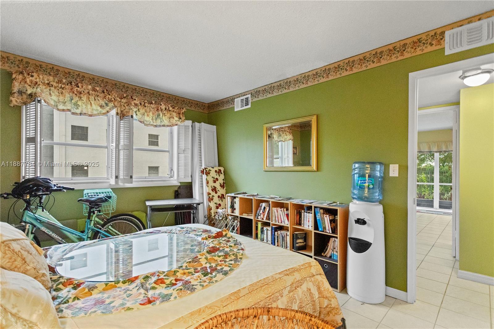 4800 Hillcrest Lane, Unit 101 Hollywood, FL 33021 - Photo 17 of 35 a living room with furniture and a baby crib