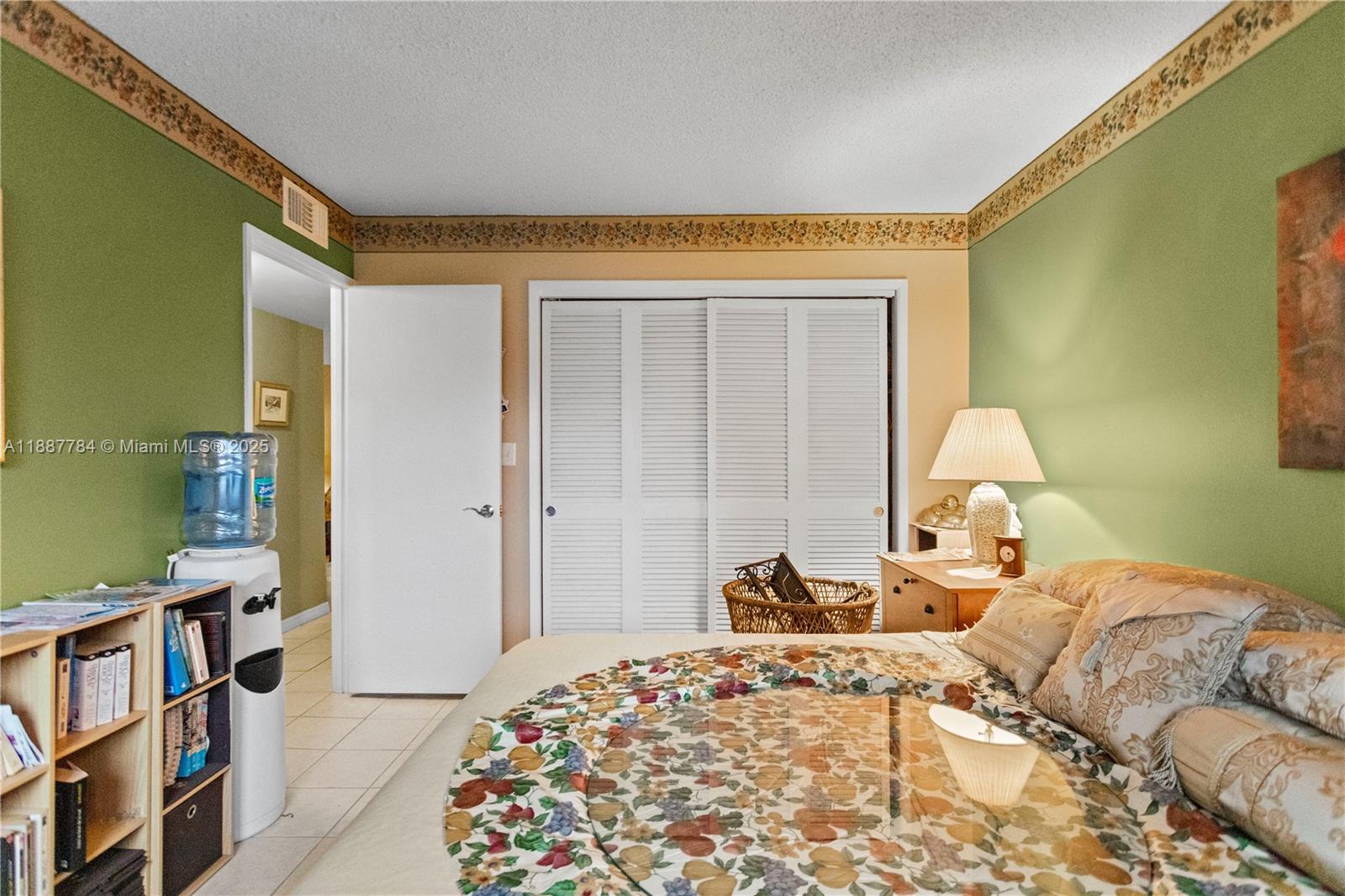4800 Hillcrest Lane, Unit 101 Hollywood, FL 33021 - Photo 18 of 35 a bedroom with a bed and a cabinets