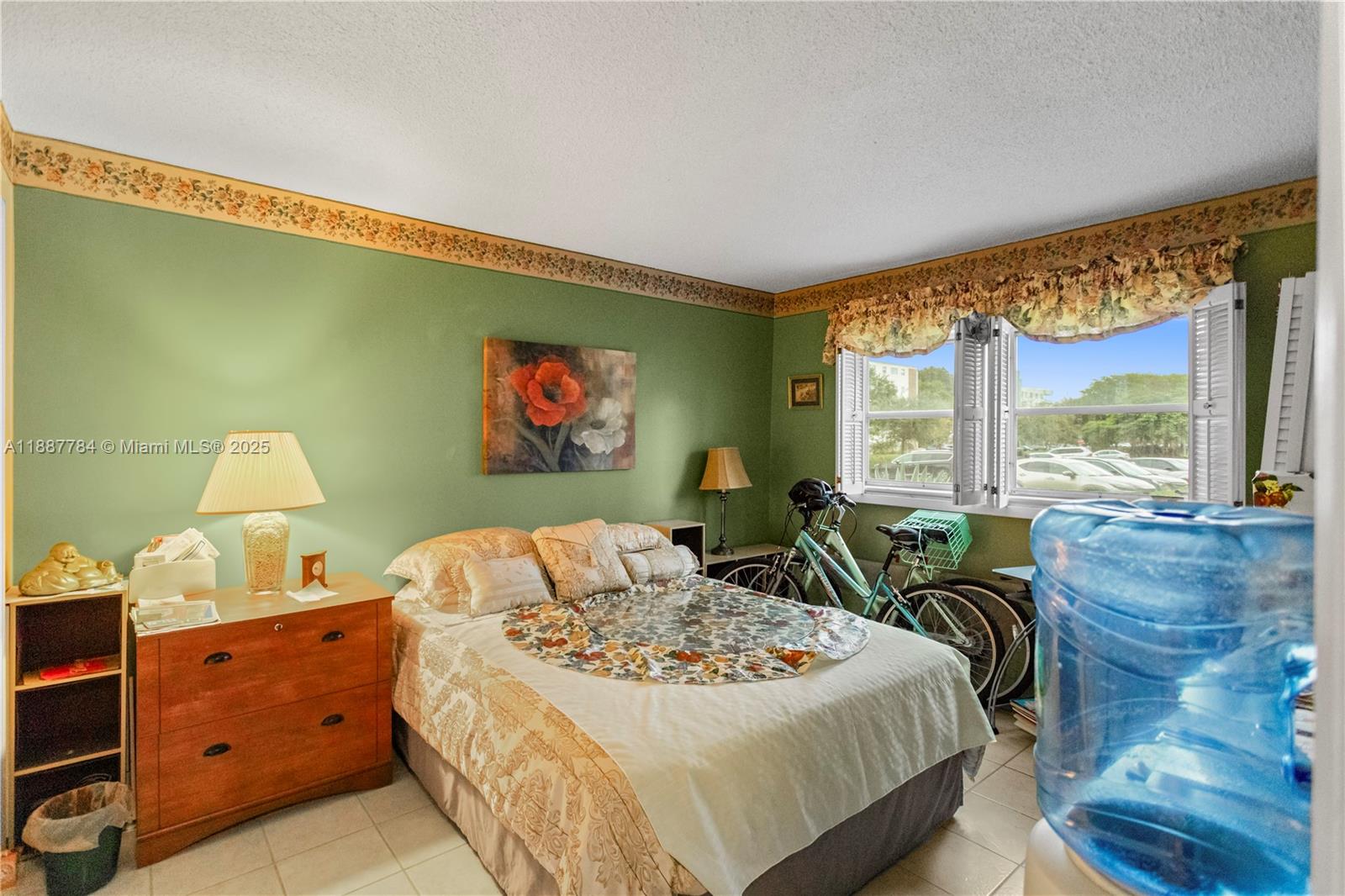 4800 Hillcrest Lane, Unit 101 Hollywood, FL 33021 - Photo 19 of 35 a bed room with furniture and a large window