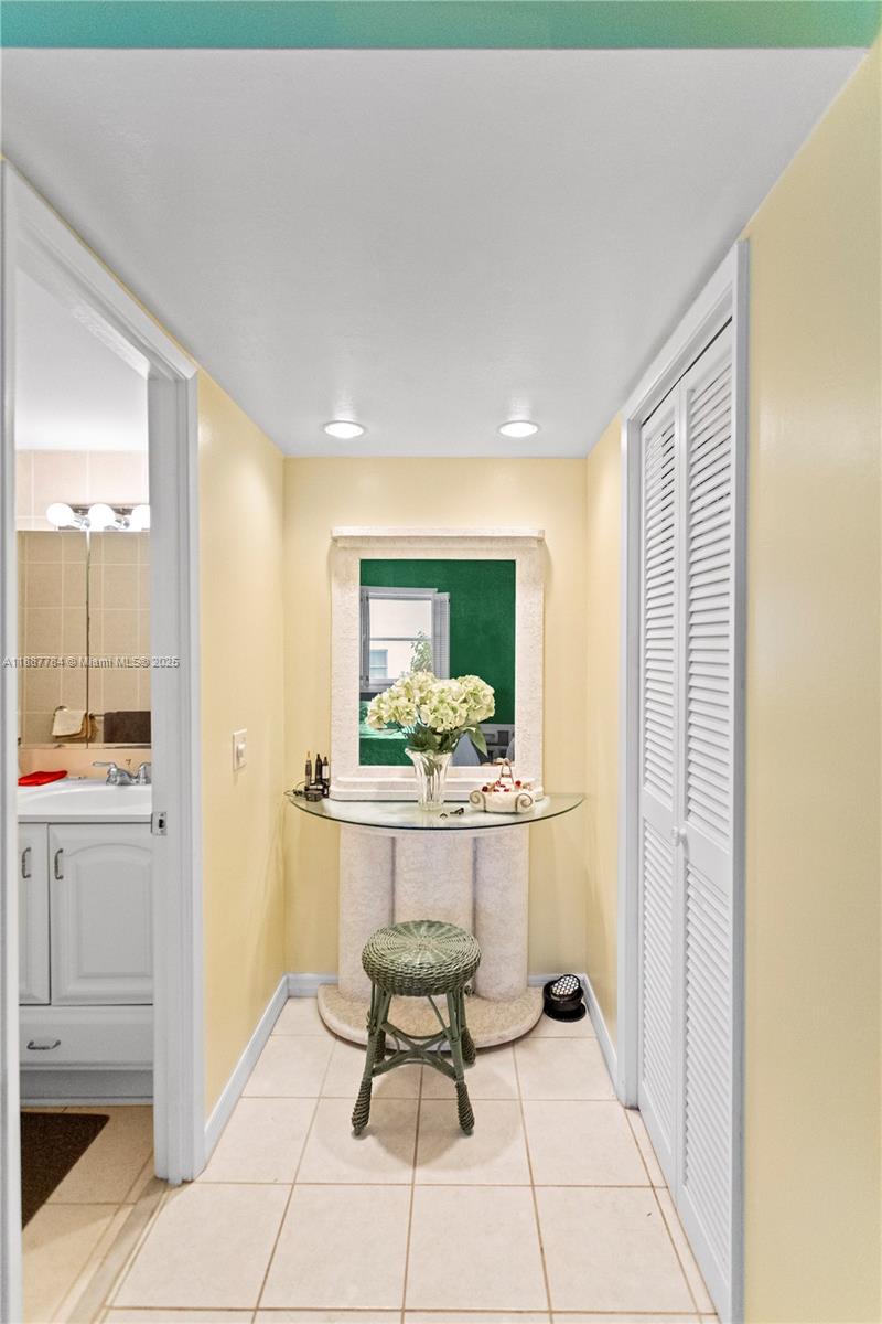 4800 Hillcrest Lane, Unit 101 Hollywood, FL 33021 - Photo 28 of 35 a kitchen with a sink and chairs