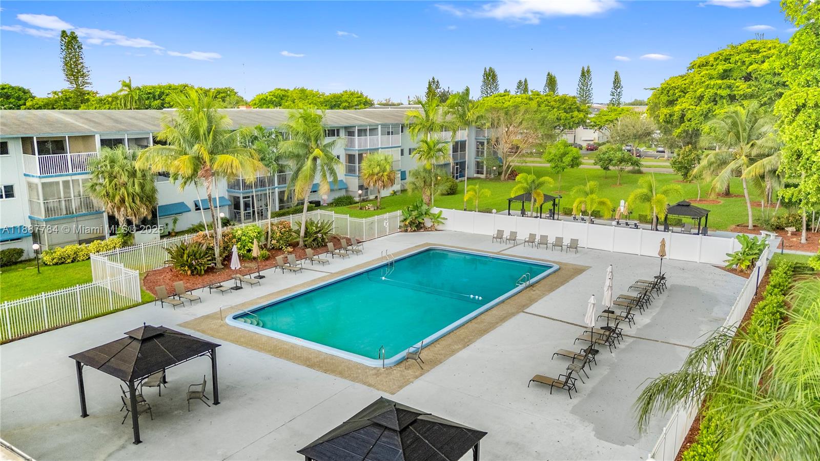 4800 Hillcrest Lane, Unit 101 Hollywood, FL 33021 - Photo 30 of 35 a view of a patio with a table and chairs