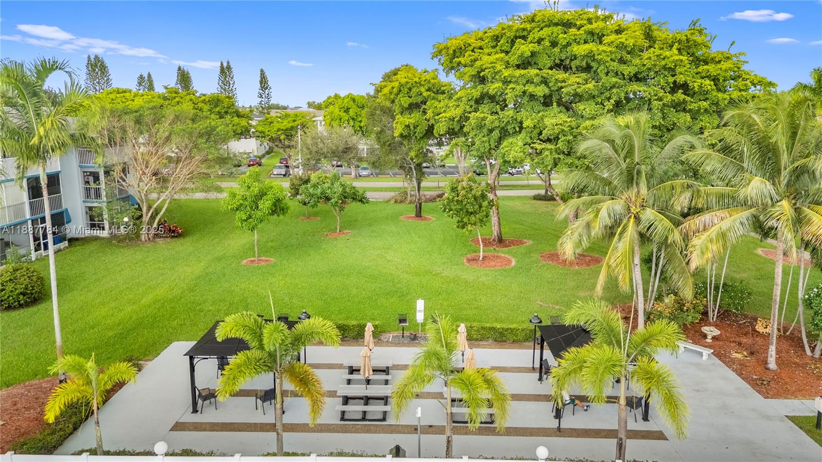 4800 Hillcrest Lane, Unit 101 Hollywood, FL 33021 - Photo 31 of 35 a view of an outdoor space and seating area