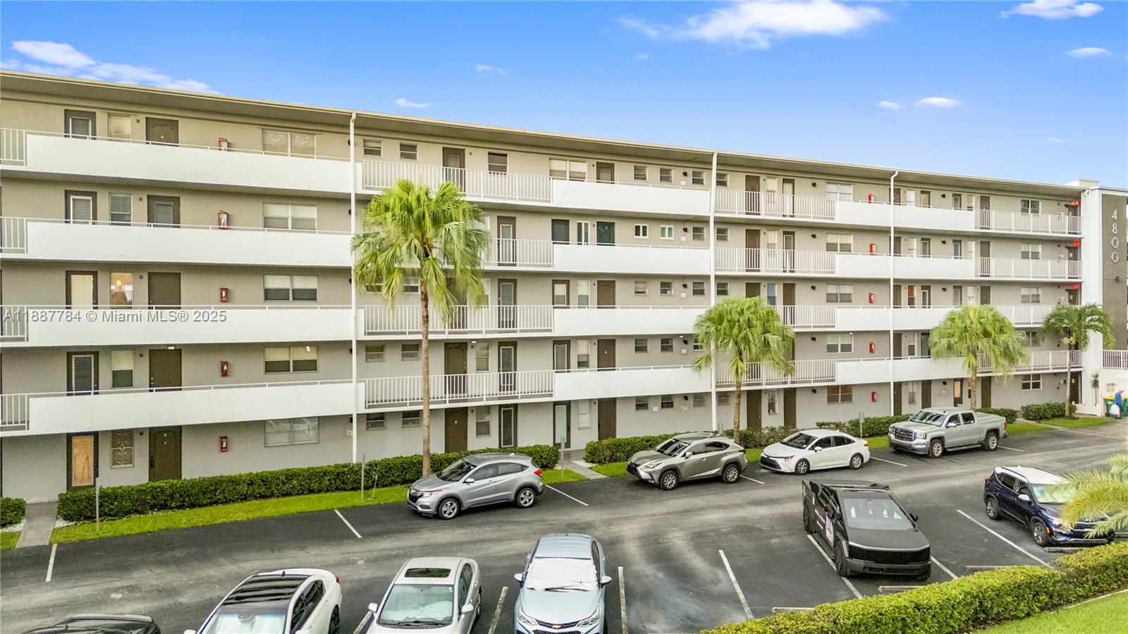4800 Hillcrest Lane, Unit 101 Hollywood, FL 33021 - Photo 34 of 35 a car parked in front of a building