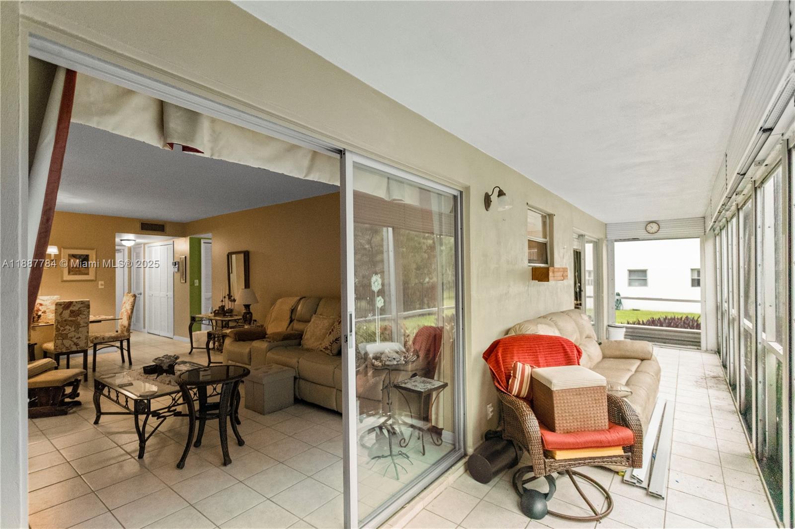 4800 Hillcrest Lane, Unit 101 Hollywood, FL 33021 - Photo 5 of 35 a living room filled with furniture and a potted plant