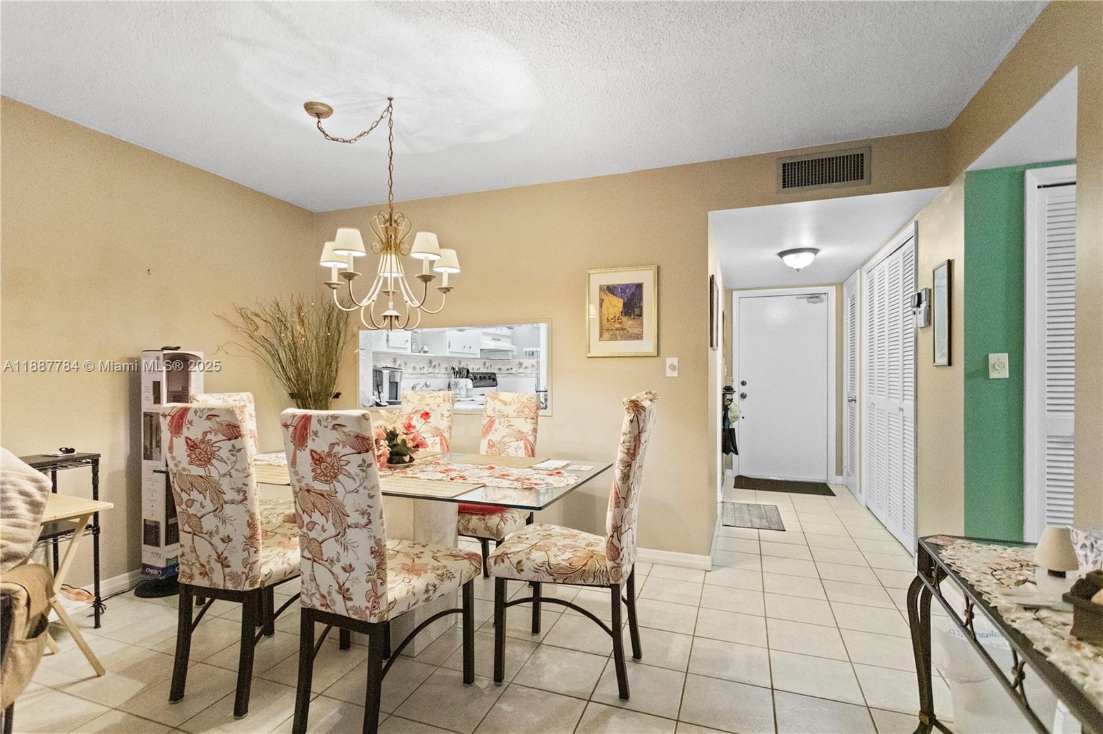 4800 Hillcrest Lane, Unit 101 Hollywood, FL 33021 - Photo 10 of 35 a dining room with furniture and window