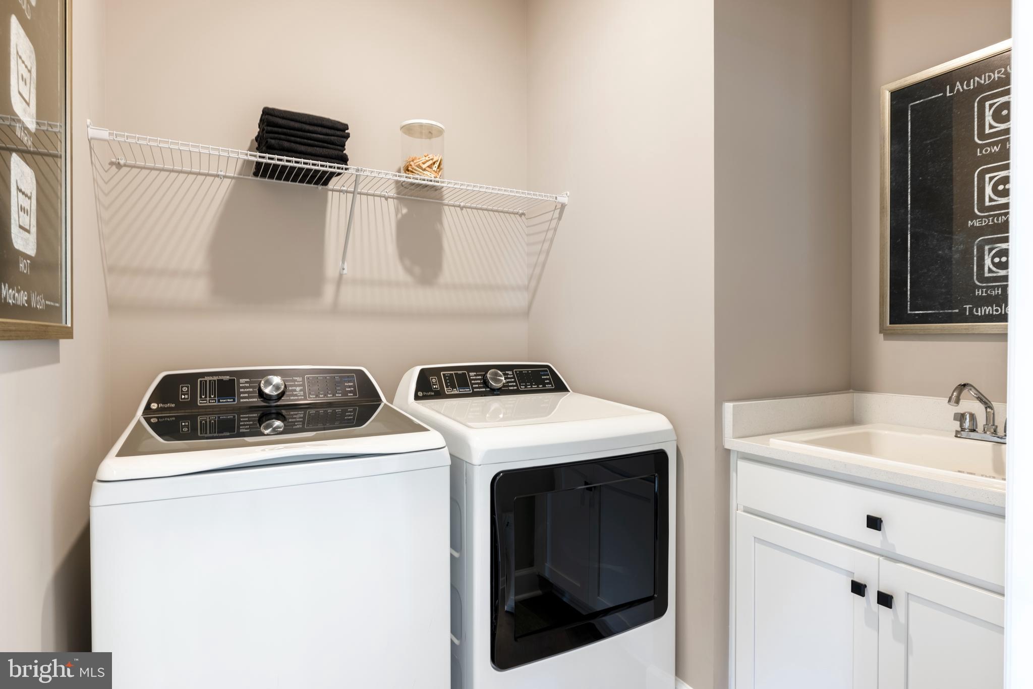 6497 Swimmer Row Way Columbia, MD 21044 - Photo 18 of 41 a utility room with dryer and washer