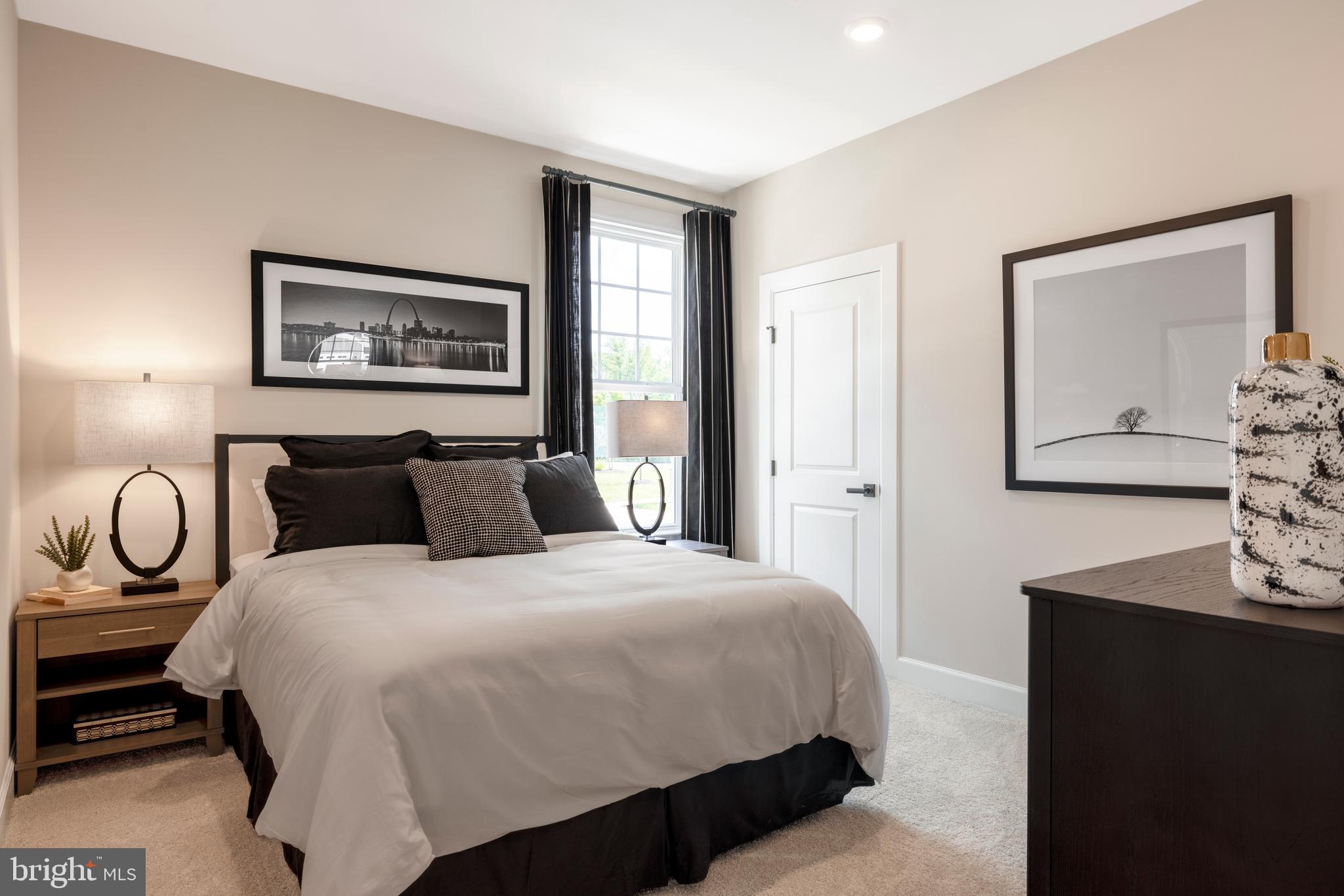 6497 Swimmer Row Way Columbia, MD 21044 - Photo 19 of 41 a bedroom with bed and wall painting