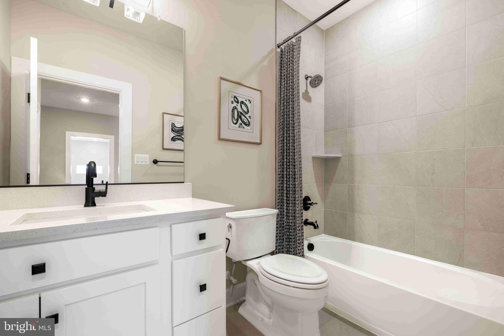 6497 Swimmer Row Way Columbia, MD 21044 - Photo 20 of 41 a bathroom with a sink a toilet and a bathtub