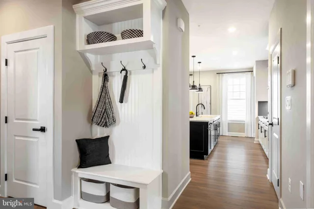 a bathroom with a toilet a sink and a mirror