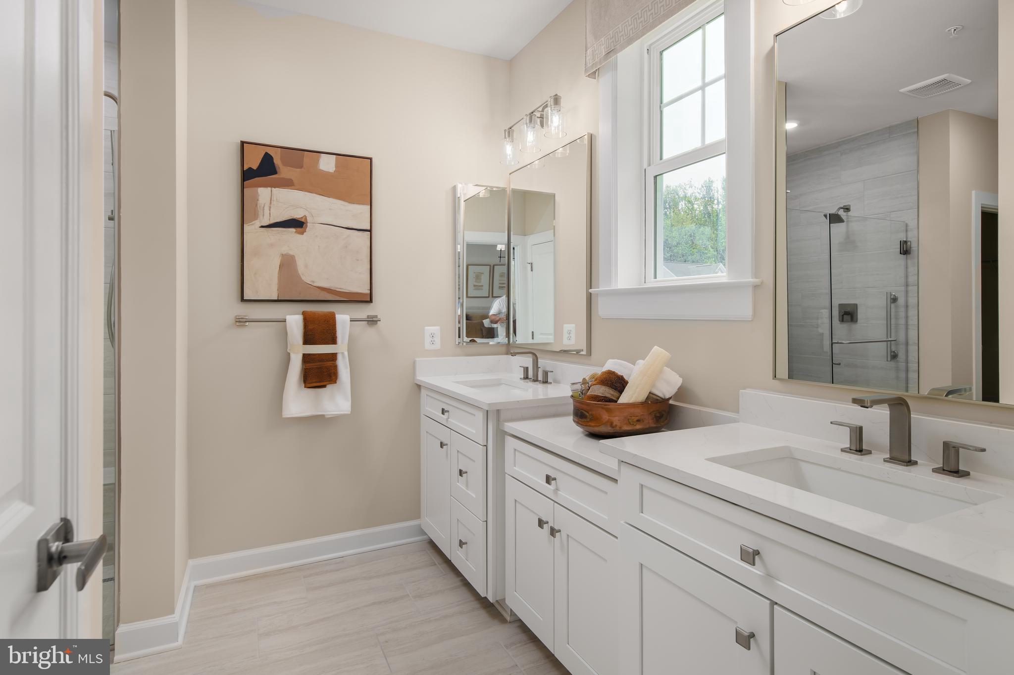 6497 Swimmer Row Way Columbia, MD 21044 - Photo 27 of 41 a bathroom with a double vanity sink mirror and double