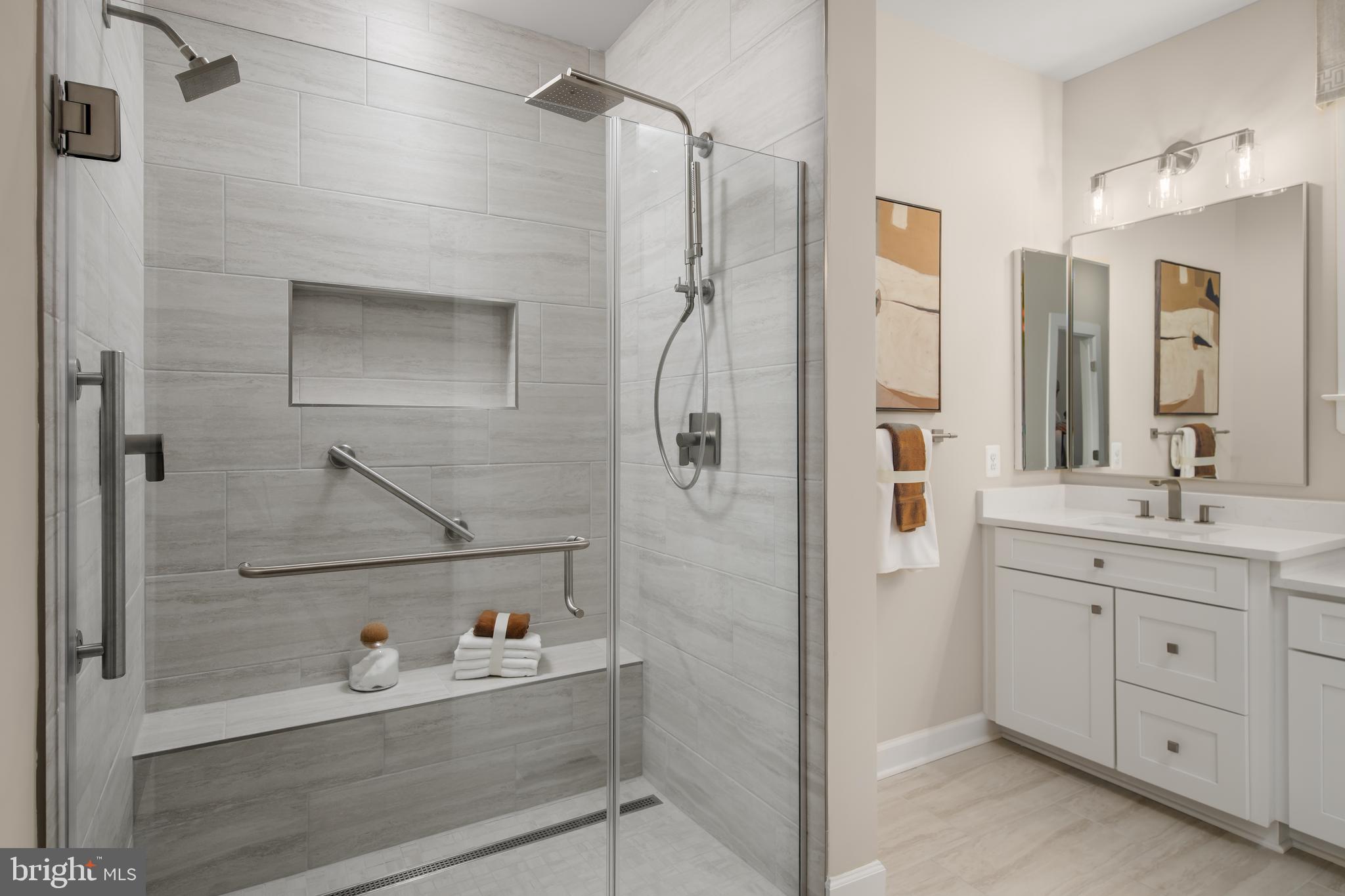 6497 Swimmer Row Way Columbia, MD 21044 - Photo 29 of 41 a bathroom with a bathtub sink vanity and mirror