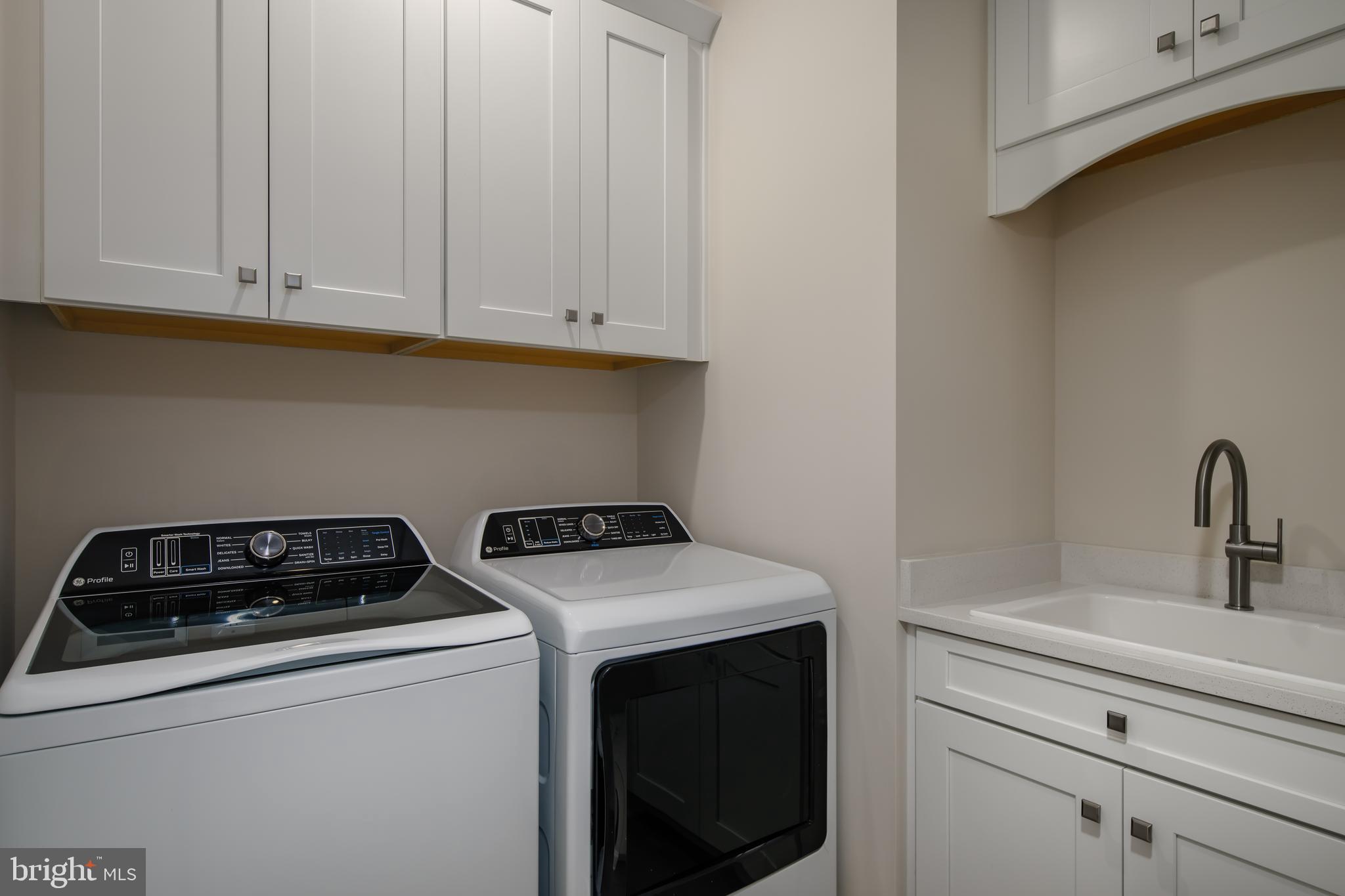 6497 Swimmer Row Way Columbia, MD 21044 - Photo 32 of 41 a utility room with dryer and washer